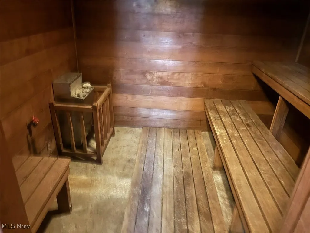 Relaxing sauna featuring wooden walls