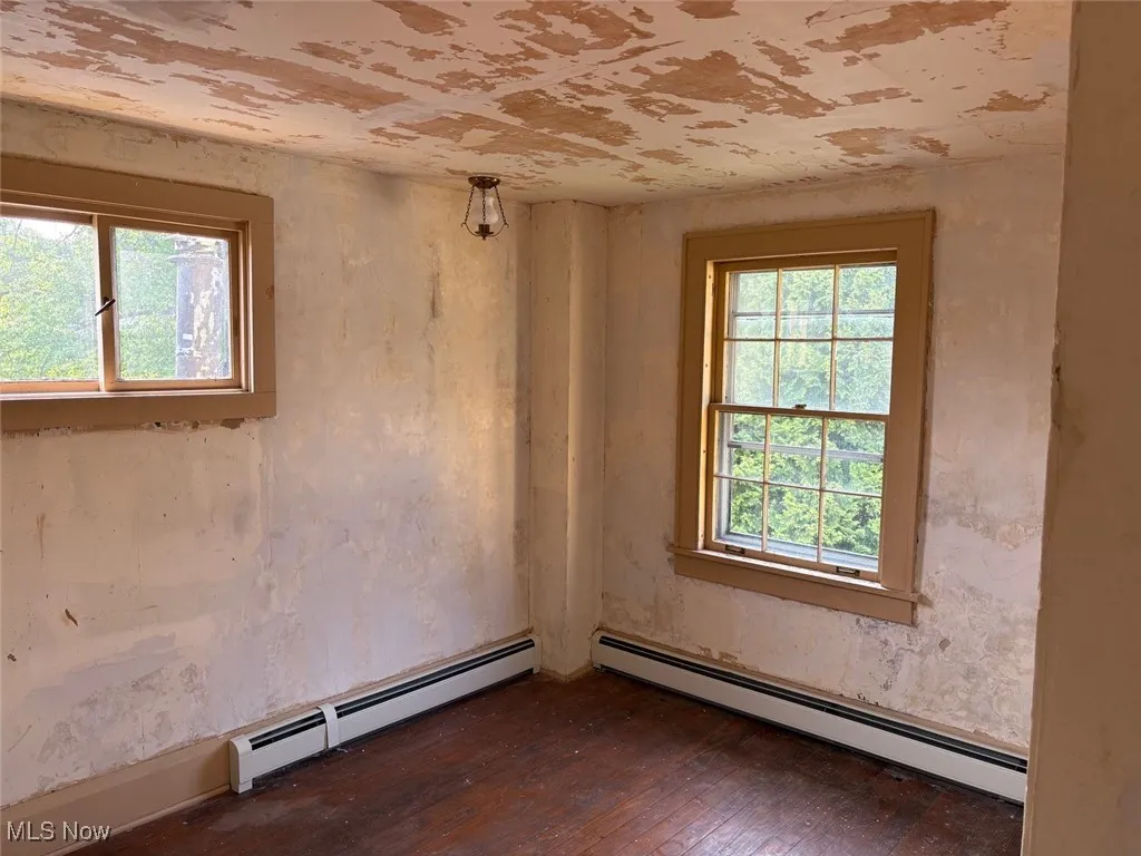 Bedroom 4 with access to the back stairs to the kitchen
