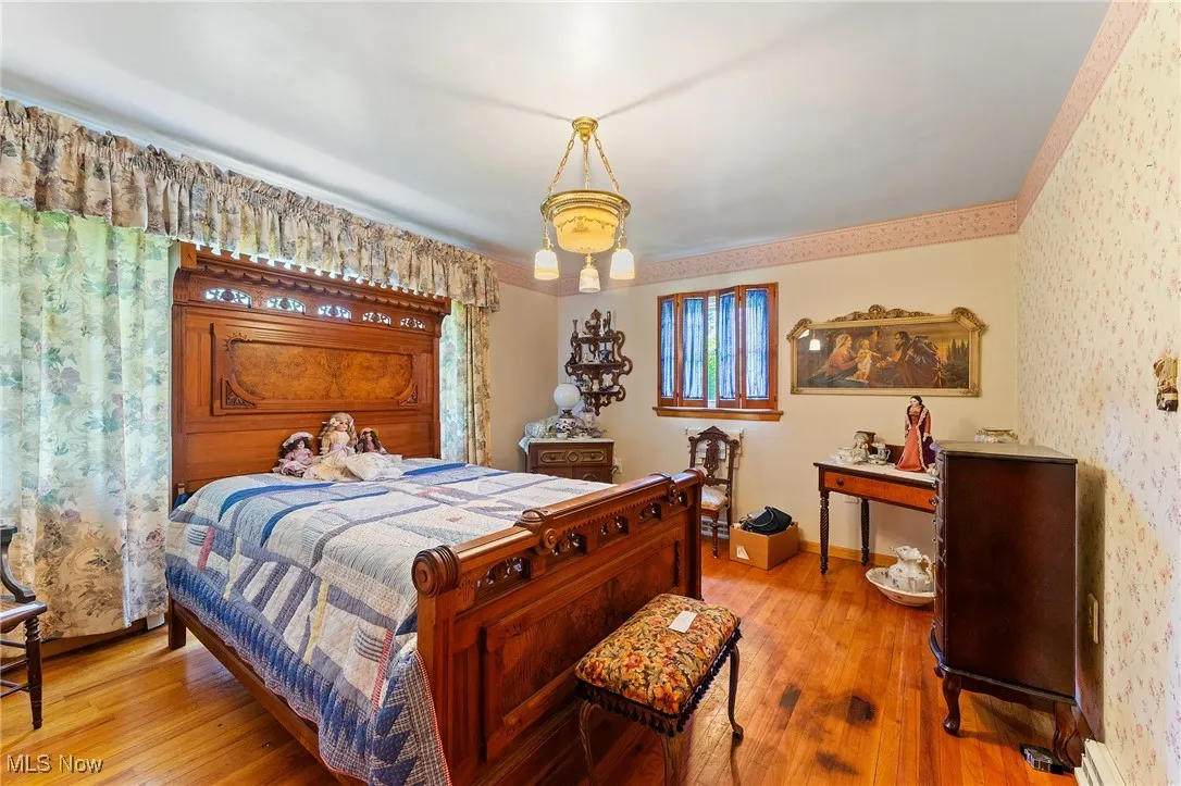 Bedroom with hardwood  floors .