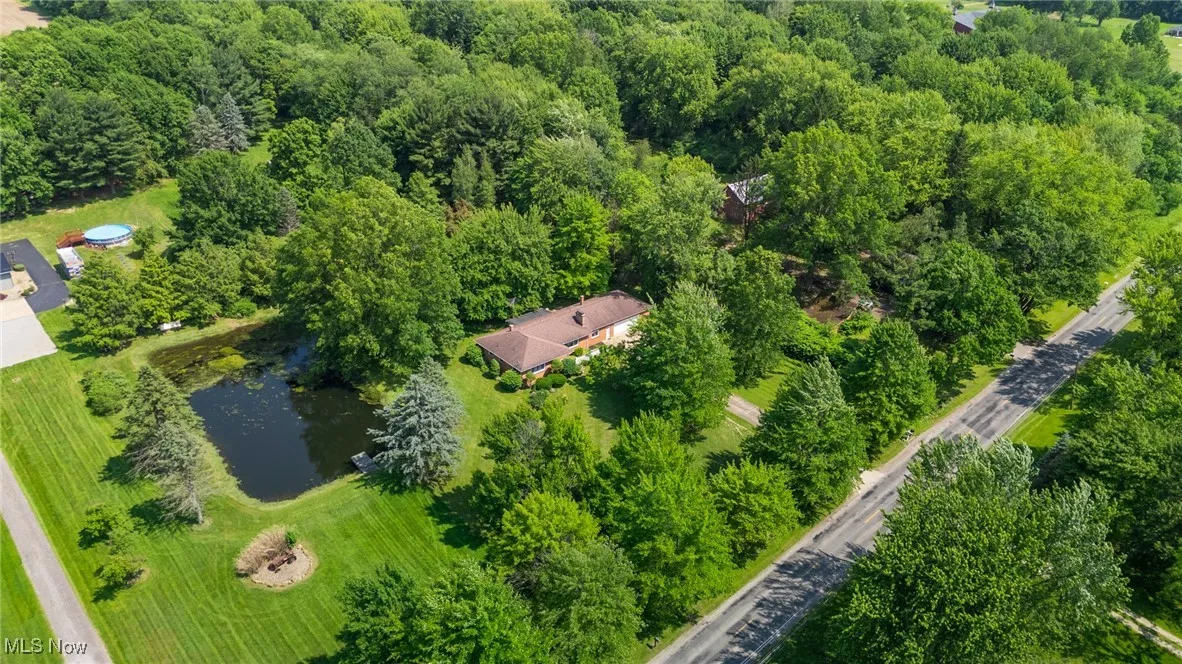 Aerial overview of property's location with a nearby body of water