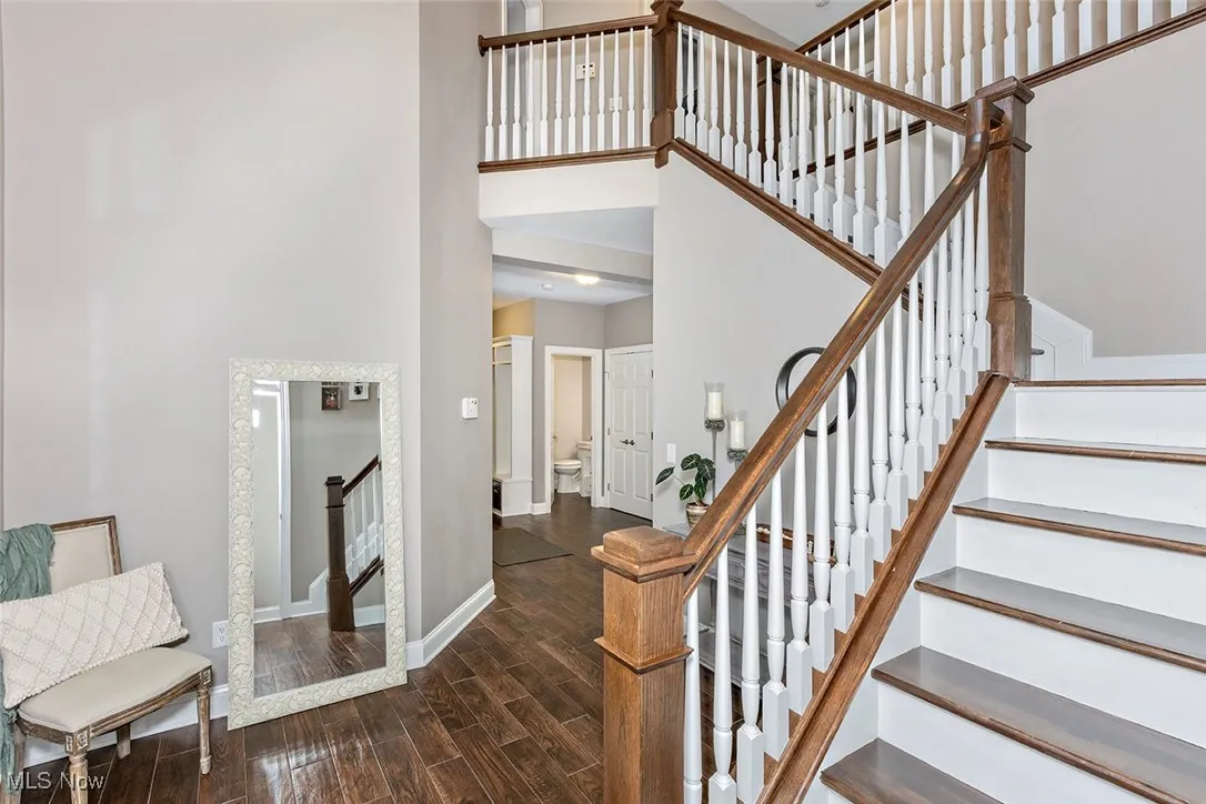 Striking entryway to home, with access through to mudroom and living space and half bath.