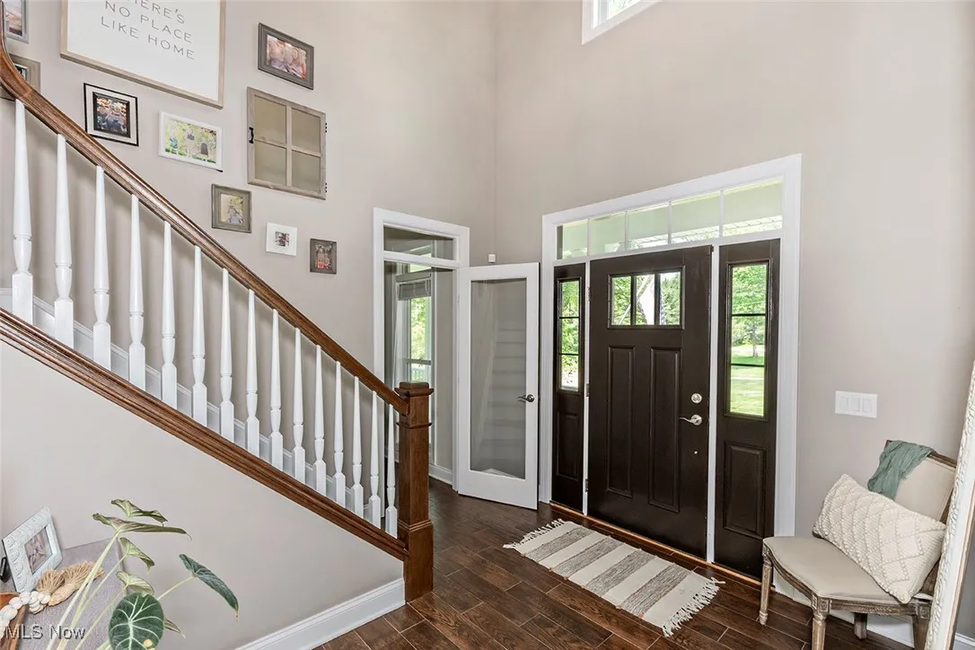 Two story, welcoming foyer. Entry to the private office, great for in-home work space.
