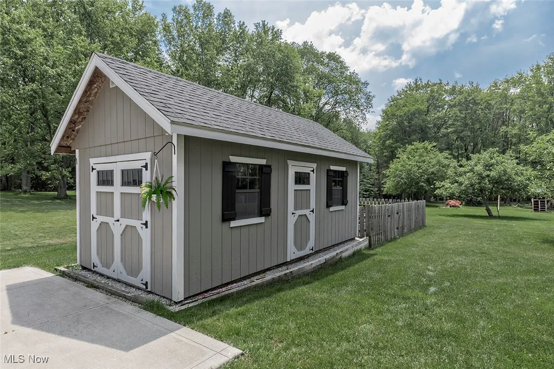 Garden storage shed with fenced garden.