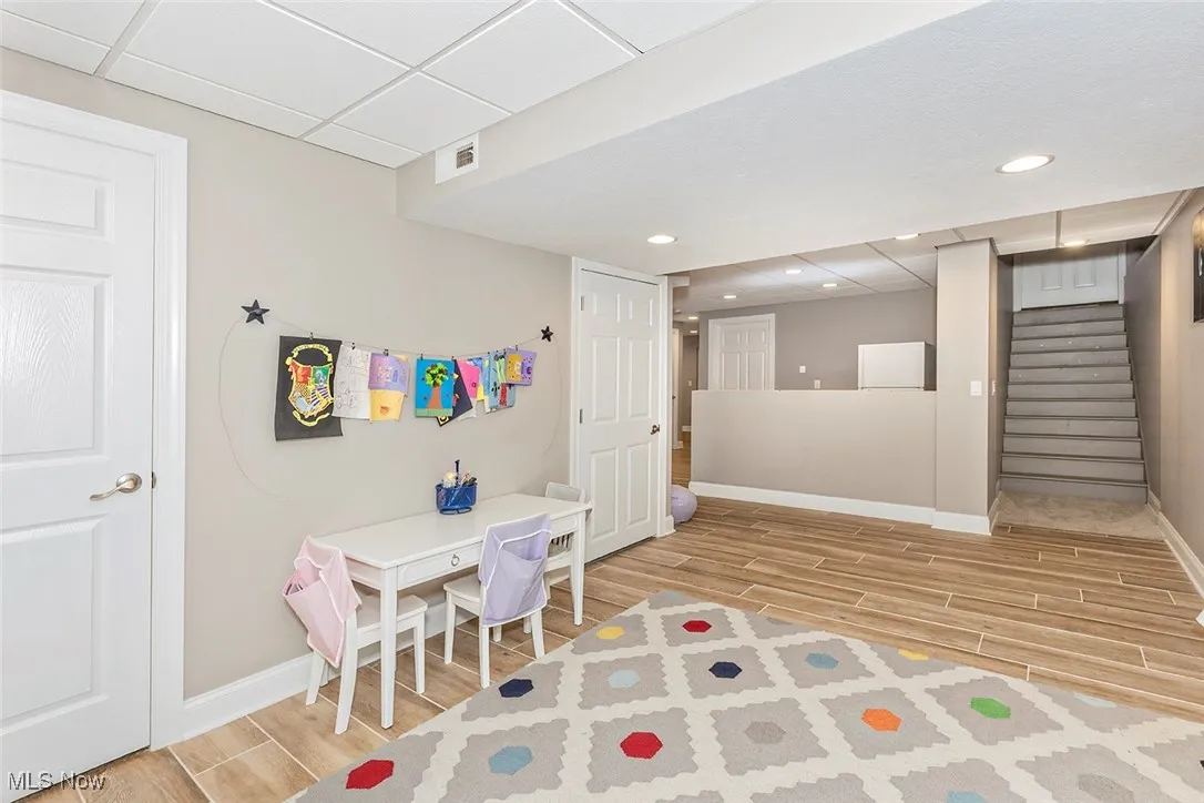 Great space for play and crafting, with view to stairs off the garage and area alocated for future kitchenette. (could be an option for another suite).