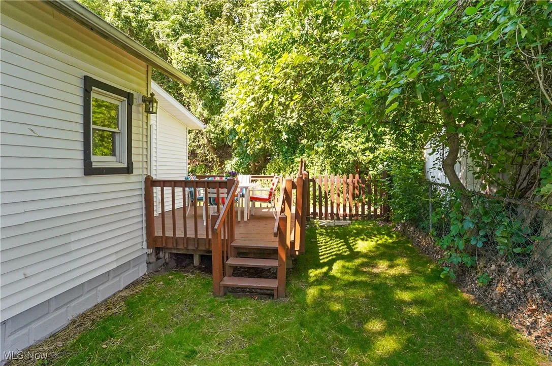 View of yard with a wooden deck
