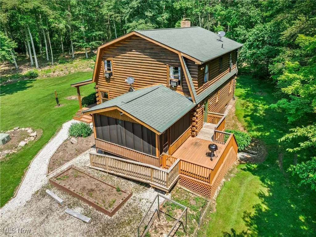 View from above of property with a forest