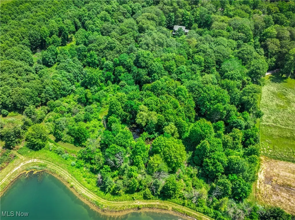 Aerial overview of property's location featuring a nearby body of water