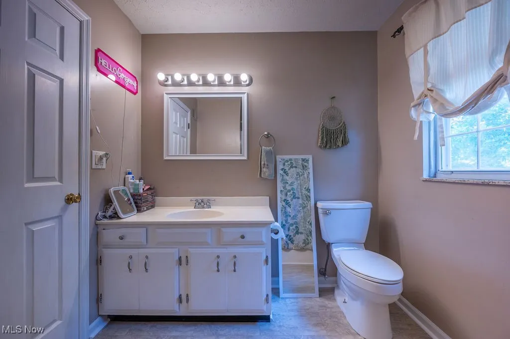 Bathroom with baseboards and vanity