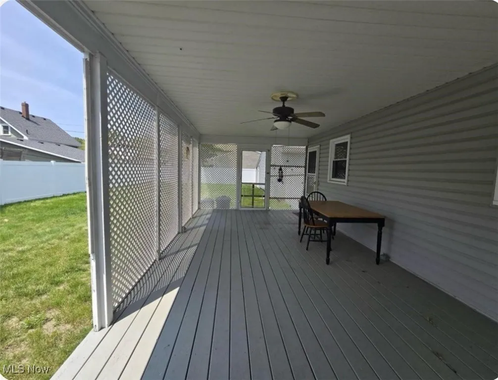 Wooden terrace with a ceiling fan