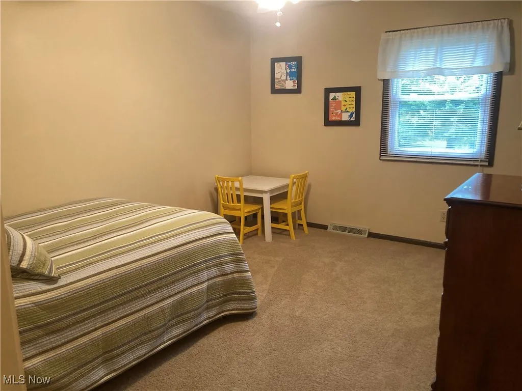 Bedroom with carpet and baseboards
