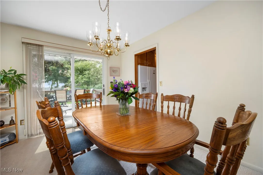 Dining room with sliding doors to multi level deck