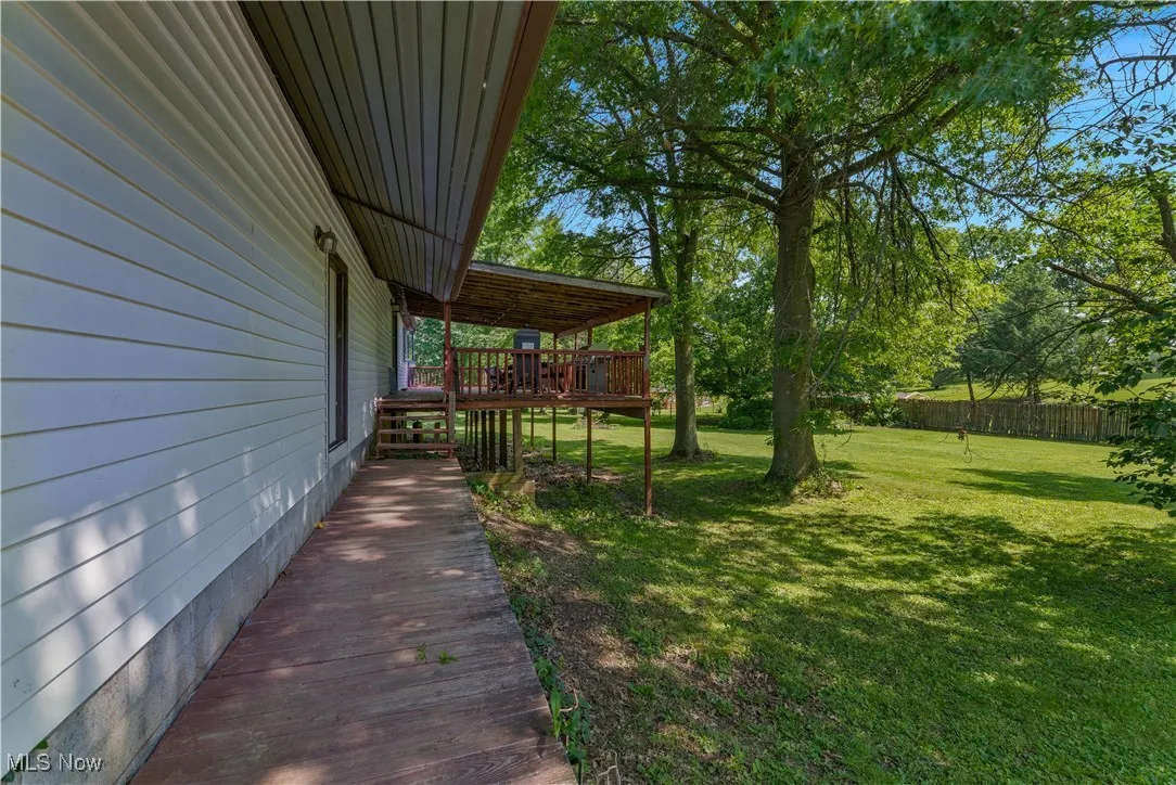 View of yard with a deck