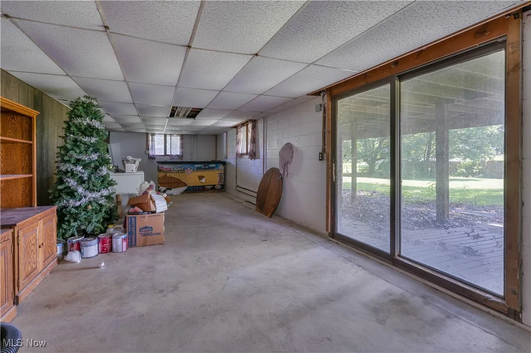 basement living area with bar and walk out