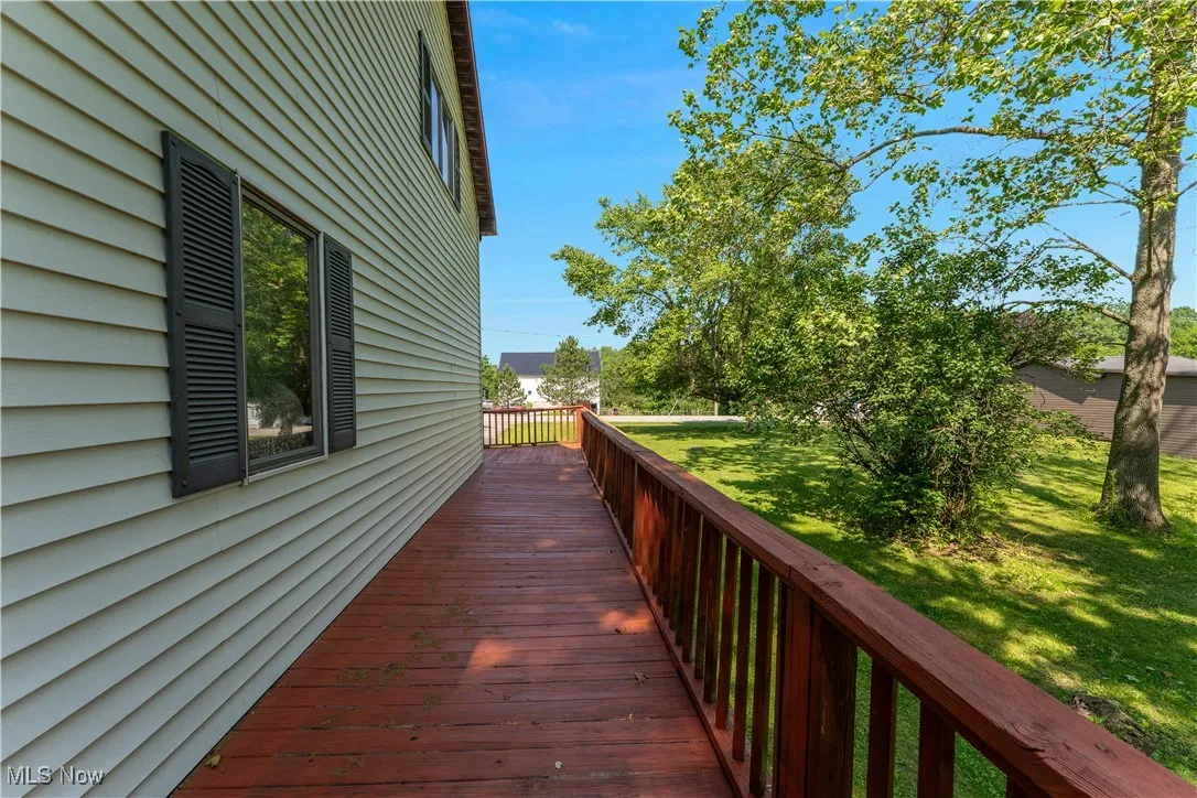 Deck featuring a lawn