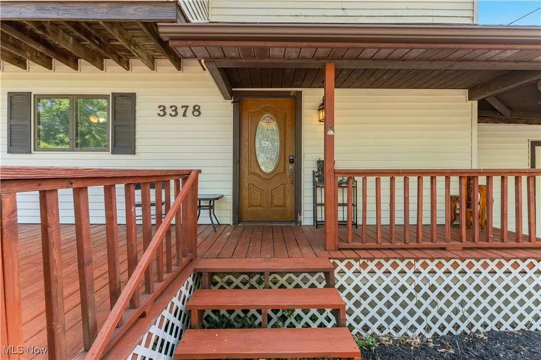 Doorway to property featuring a porch