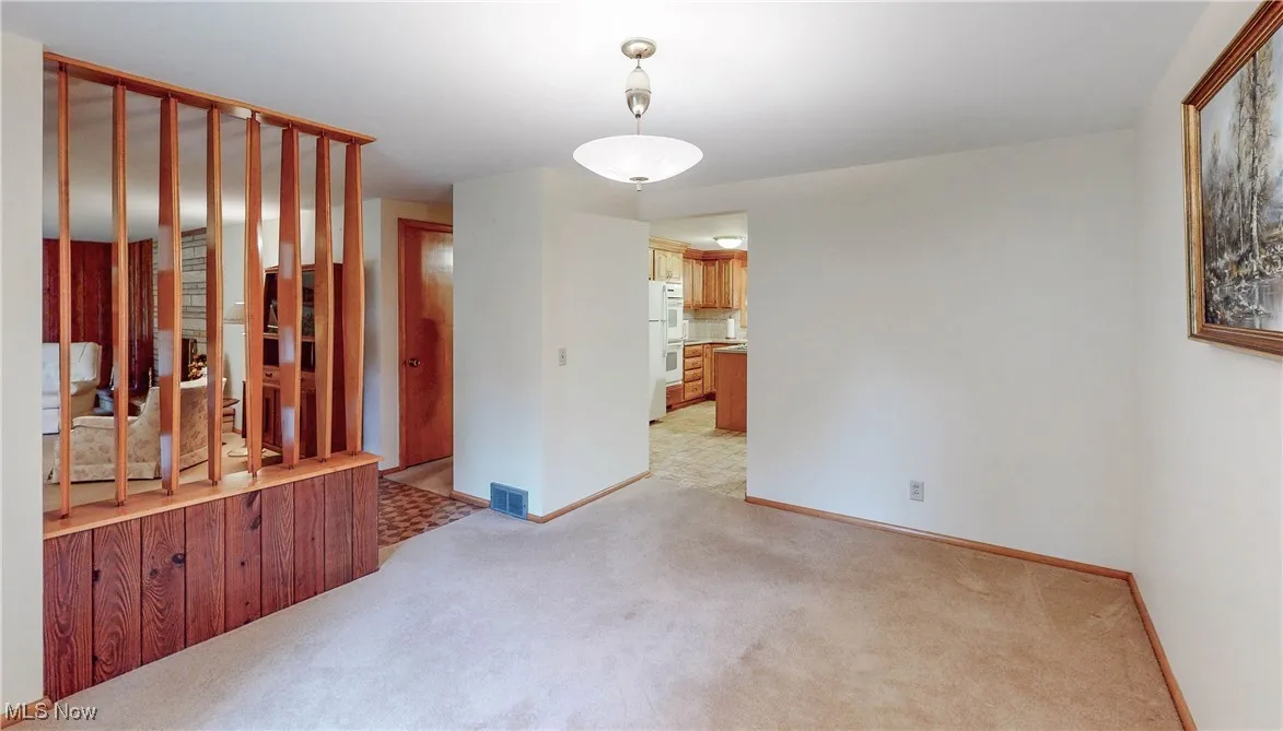 Dining Room featuring light carpet