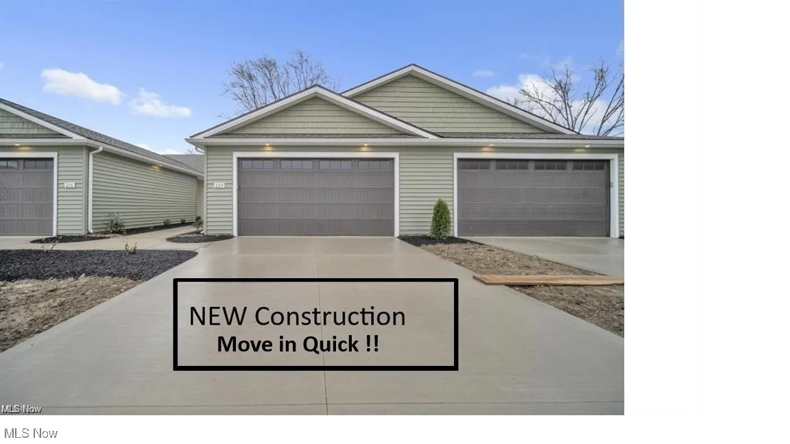 View of front of house with concrete driveway