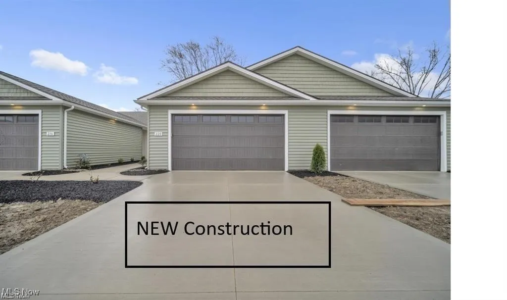 View of front facade featuring concrete driveway