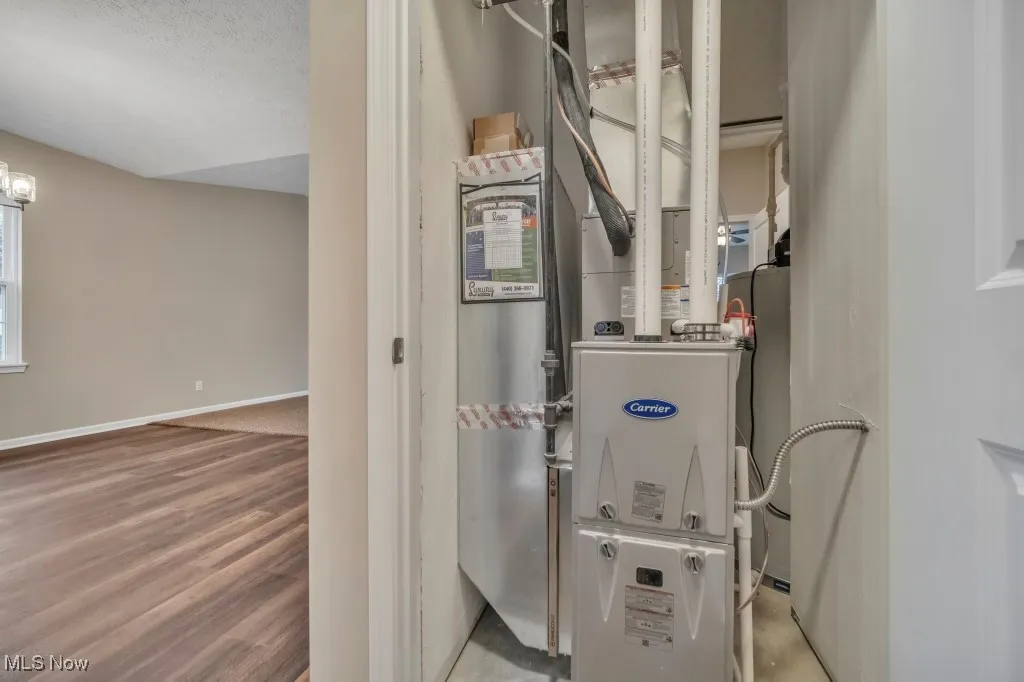 Utility room featuring heating unit