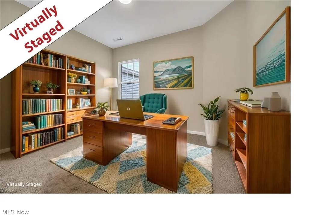 Office area featuring carpet flooring and baseboards