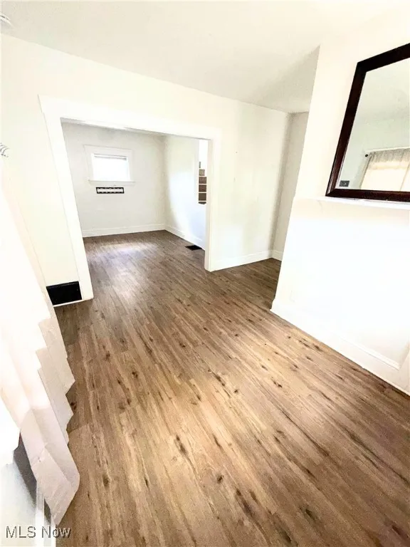 Unfurnished room with wood finished floors