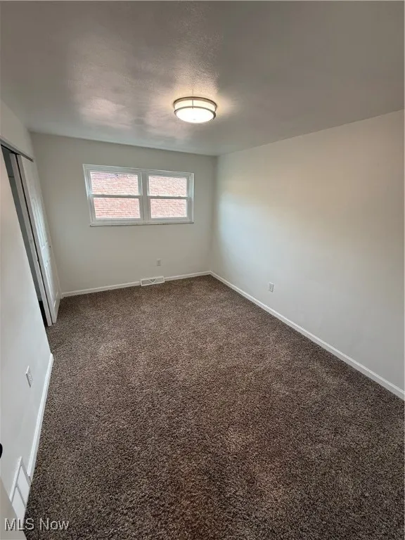 Empty room featuring baseboards and carpet​​‌​​​​‌​​‌‌​‌‌​​​‌‌​‌​‌​‌​​​‌​​ floors