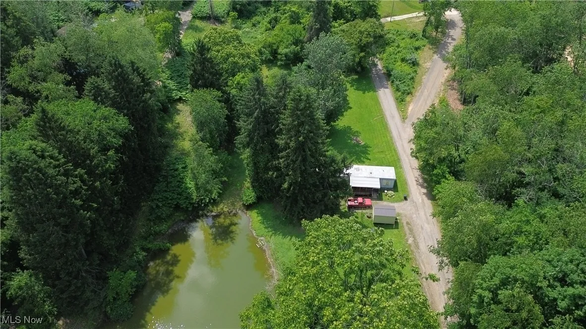 Aerial view of property's location featuring a large body of water