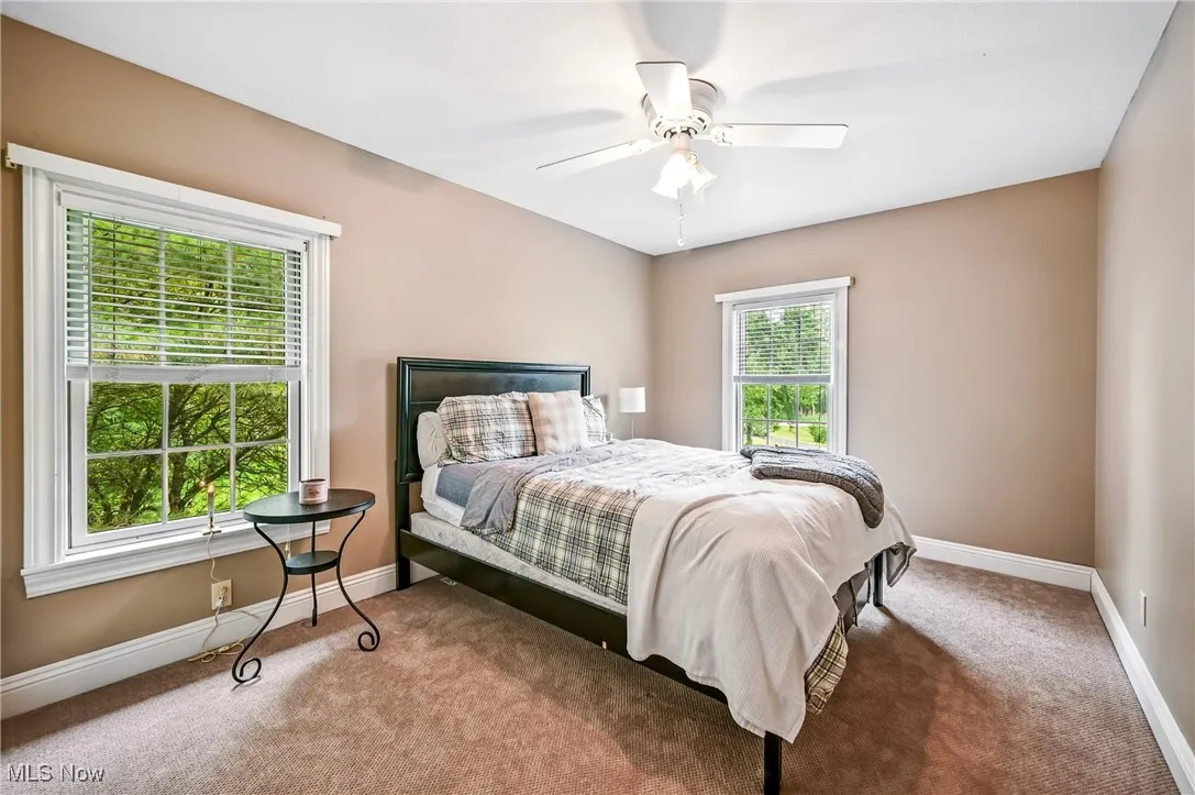 Bedroom featuring carpet floors and ceiling fan