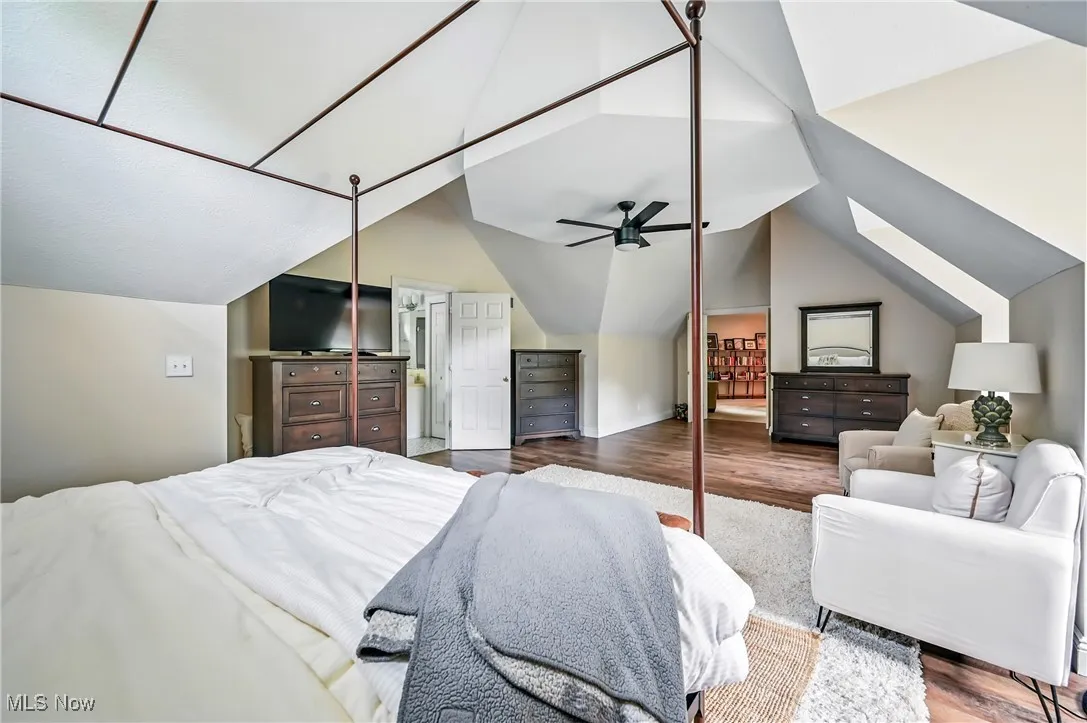 Bedroom featuring vaulted ceiling and wood finished floors