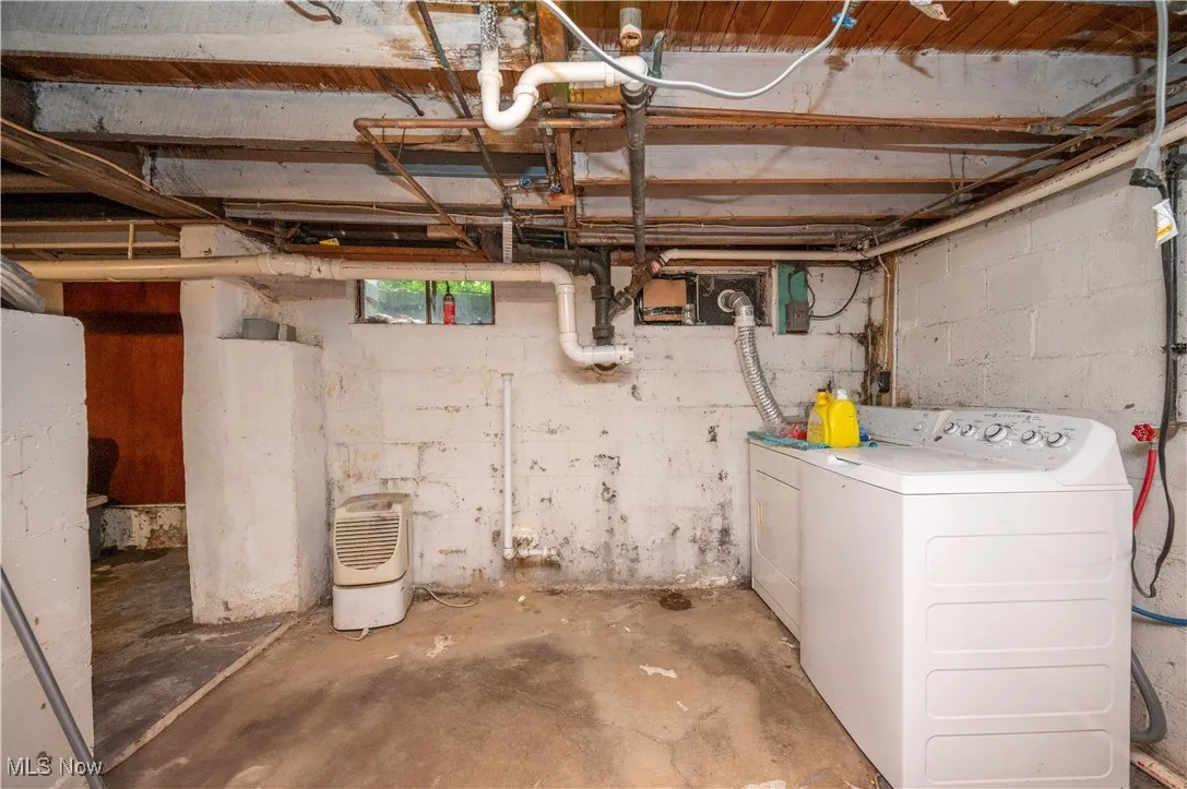 Basement featuring washer and clothes dryer