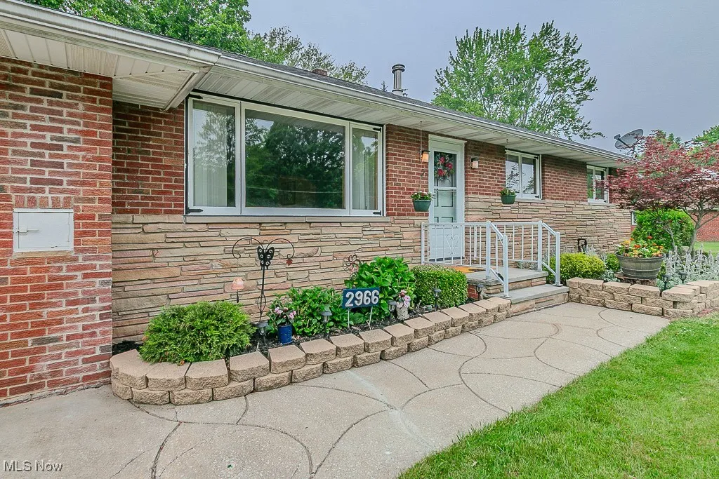 View of front of home with stone siding and brick siding