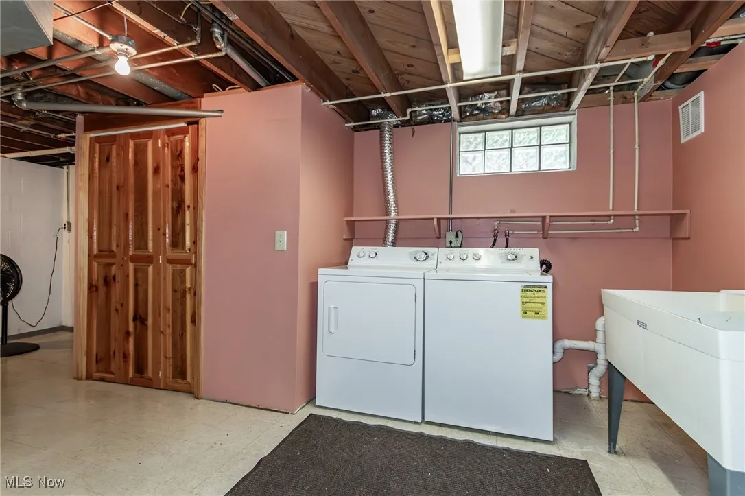 Washroom featuring washer and dryer