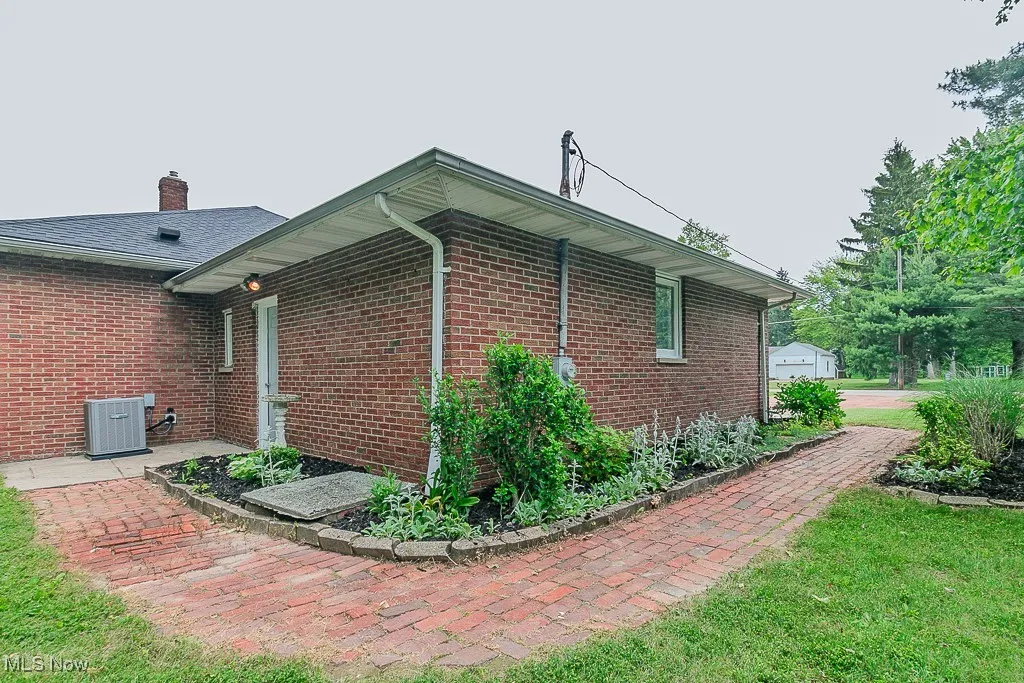 View of home's exterior with brick siding
