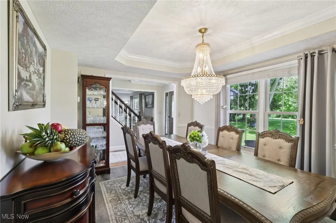 Dining space with a tray ceiling