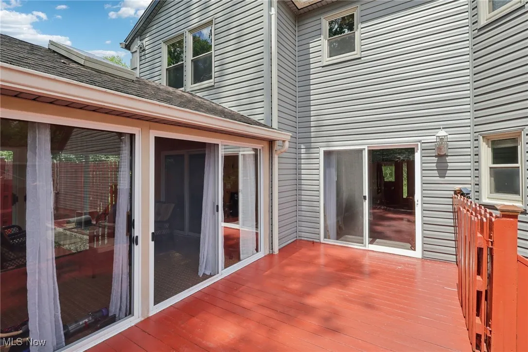 Deck featuring a sunroom