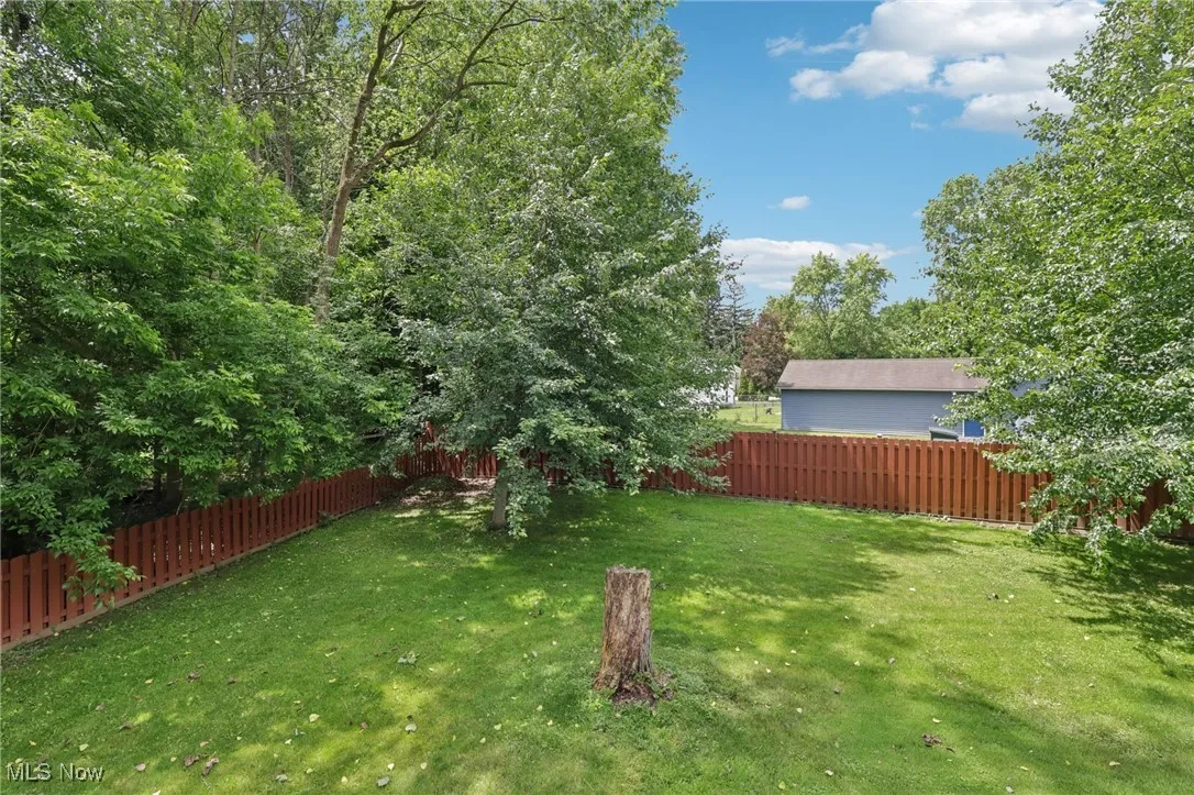 View of fenced backyard