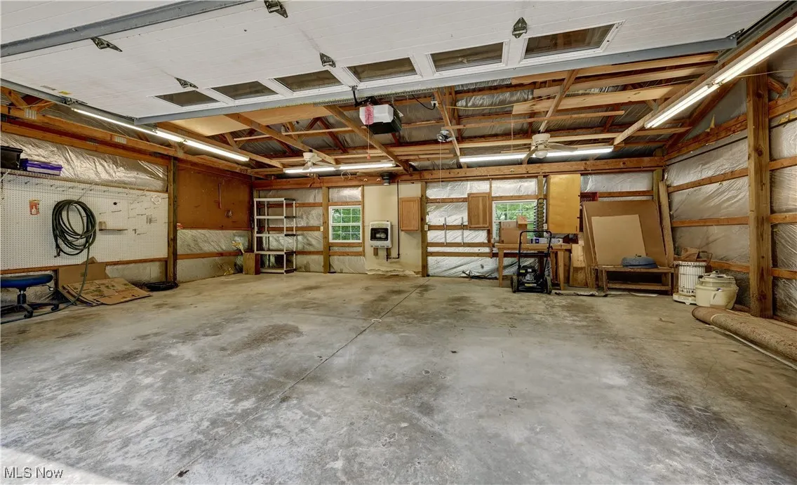 Garage featuring a garage door opener