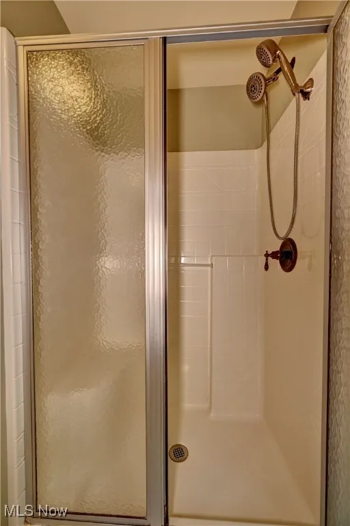 Full bath featuring a stall shower
