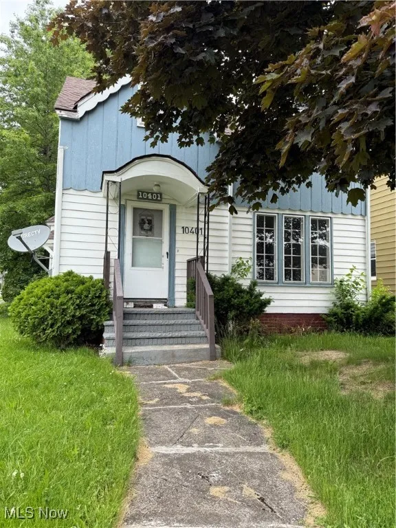 View of front of house with board and batten siding