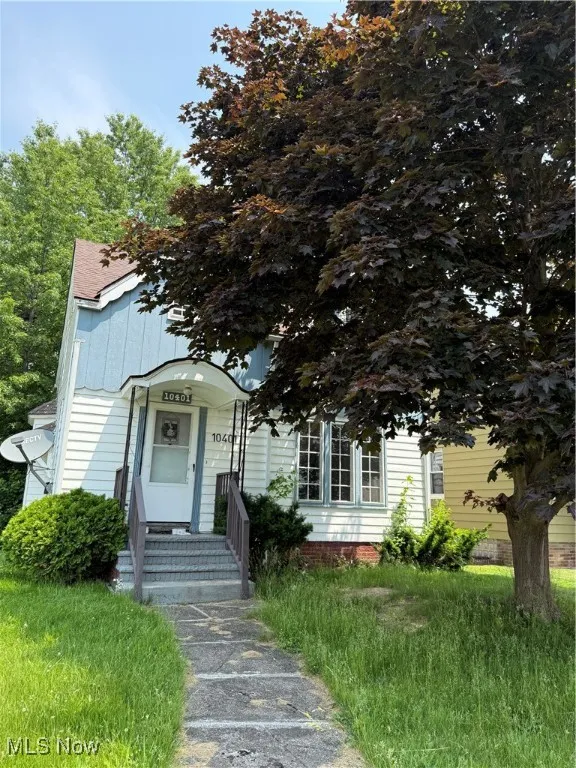 View of front of home featuring entry steps and board and batten siding
