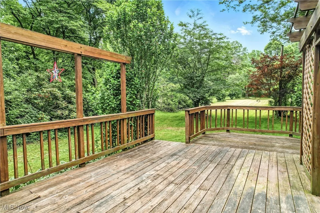 Wooden deck featuring a yard