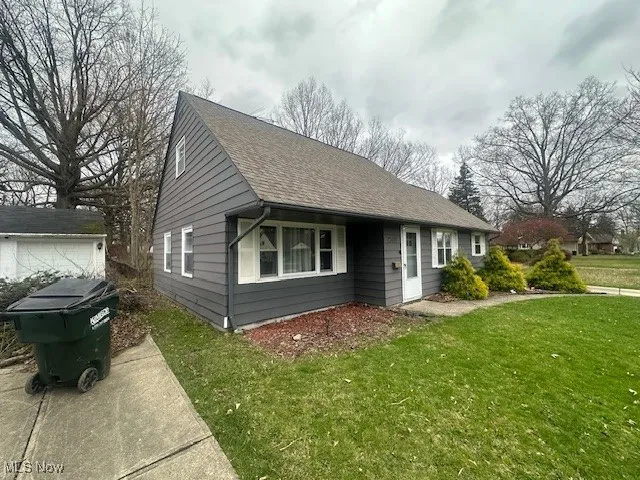 Bungalow-style home featuring a front lawn
