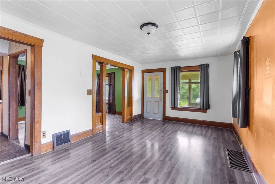Empty room with wood finished floors and baseboards
