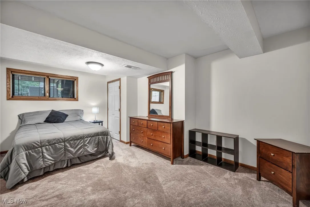 4 th bedroom Carpeted  with a textured ceiling and a closet