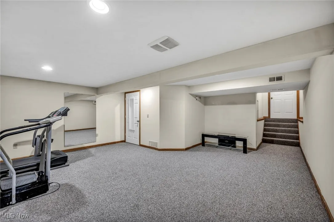 Workout area featuring carpet and recessed lighting