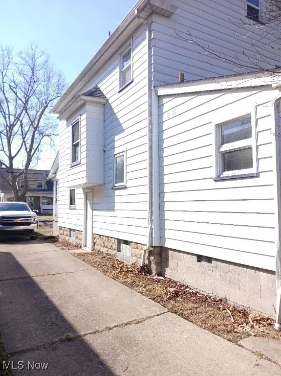 View of home's exterior with crawl space