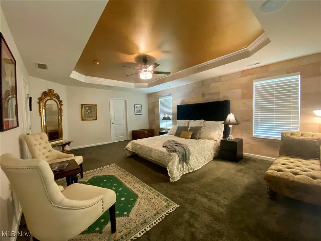 The spacious primary bedroom offers a serene retreat, complete with a private en-suite bathroom accessible through a stylish door. It’s the perfect balance of comfort and convenience, giving you a tranquil space to unwind, with easy access to your own spa-like bathroom.