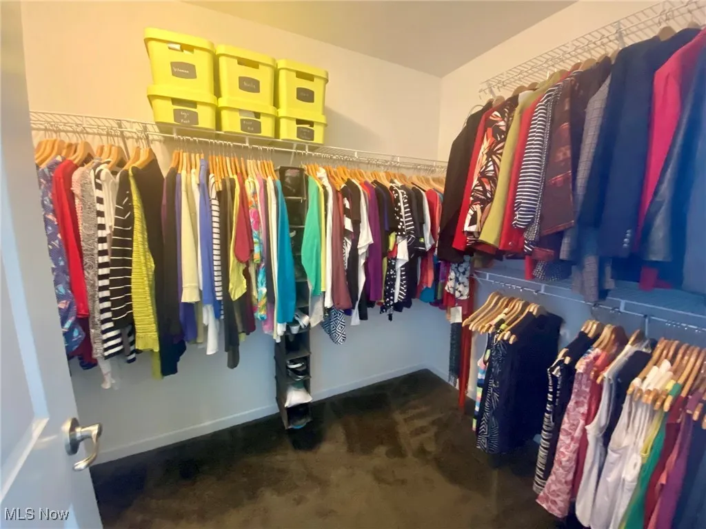 The first walk-in closet in the primary bedroom offers generous space for all your wardrobe needs, with ample shelving and hanging options to keep everything organized. It’s a practical yet luxurious feature that enhances the convenience and functionality of this beautiful retreat.