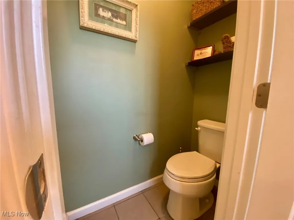 The primary en-suite bathroom features an enclosed toilet room for added privacy, complete with a built-in ventilation fan for comfort and convenience. It’s the perfect touch to enhance both functionality and tranquility in this luxurious space.