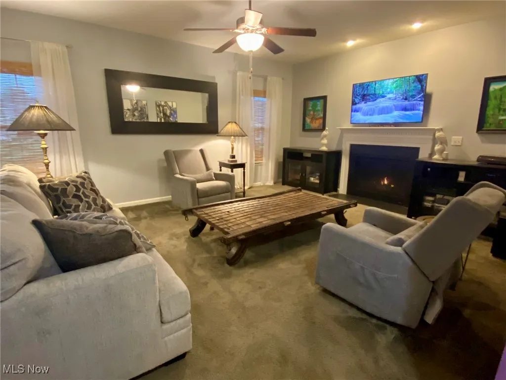 The spacious living room is anchored by a cozy, easy-start gas fireplace, offering both warmth and ambiance for any occasion. It’s the perfect spot to relax, unwind, or entertain, all year round.